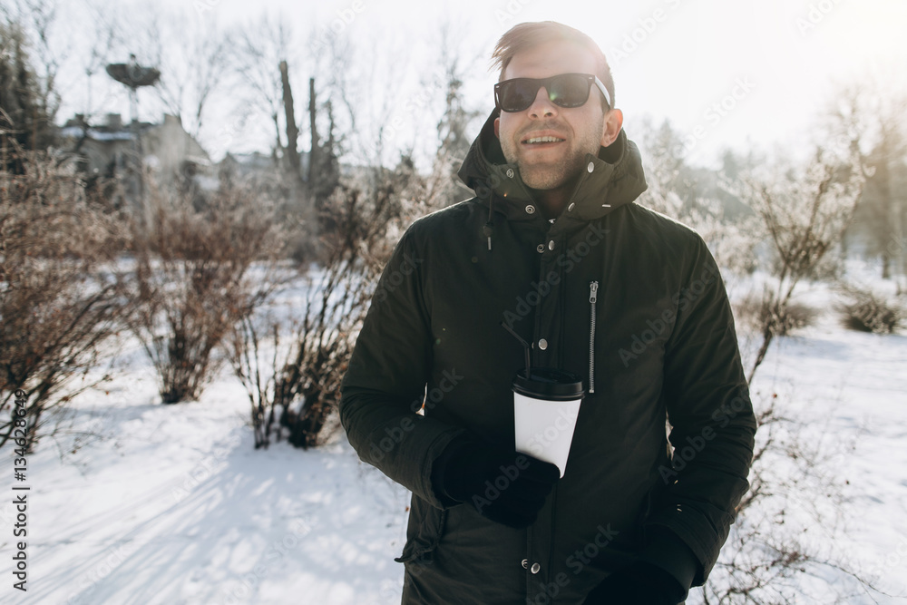 Portrait of a handsome stylish young man in winter. Portrait of a handsome stylish young man in winter.