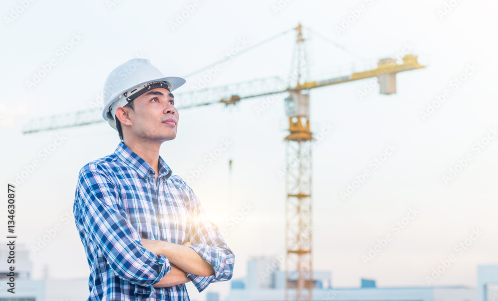 The architect wear white helmet safty on construction site with The architect wear white helmet safty on construction site with