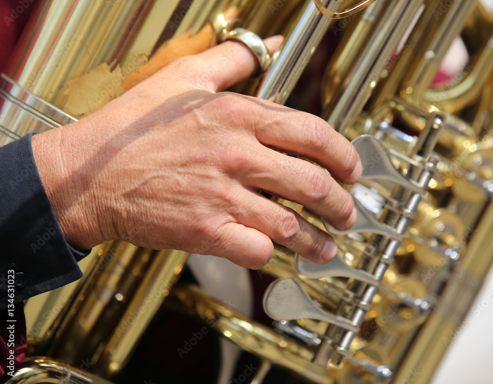 Fototapeta premium hand of player and the saxophone