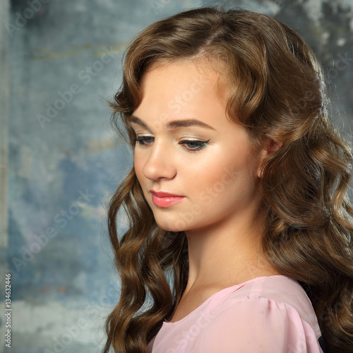 The gentle light makeup for teenagers. vintage portrait of elegant girl