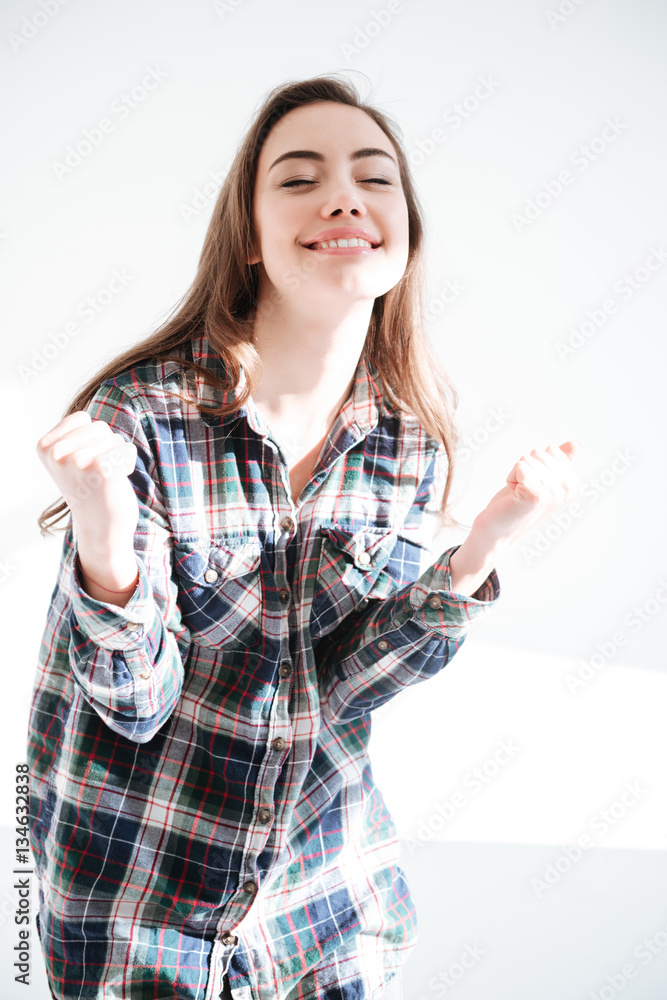 Young woman make winner gesture Young woman make winner gesture