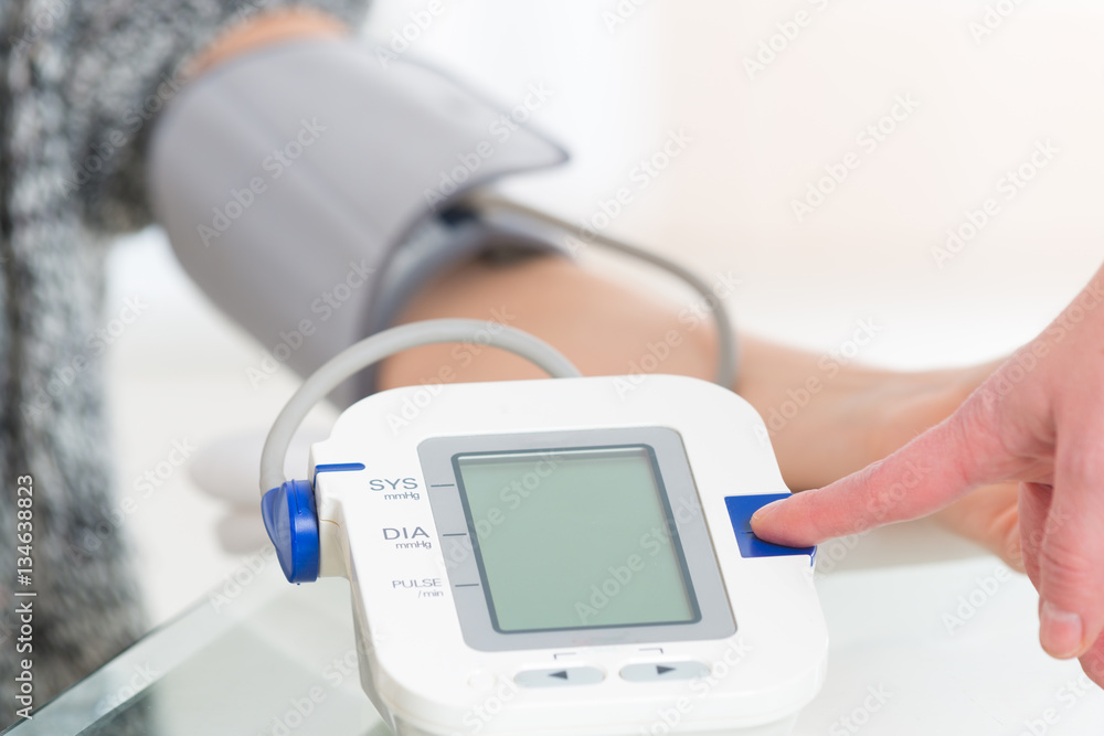 Doctor measuring blood pressure Doctor measuring blood pressure