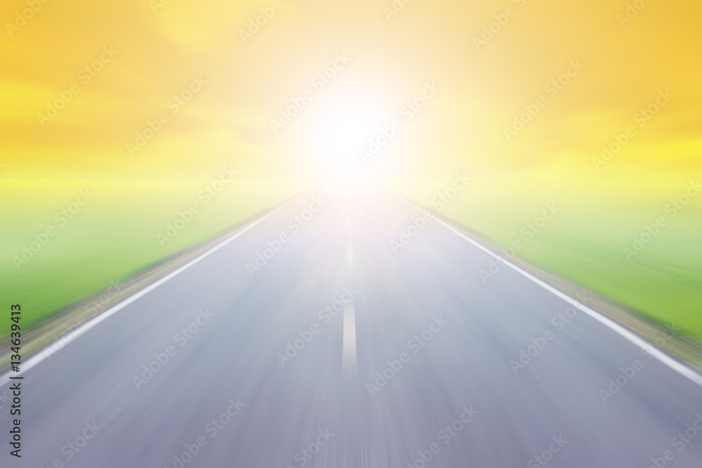 blur high speed road with cloudy sky and sunlight background at