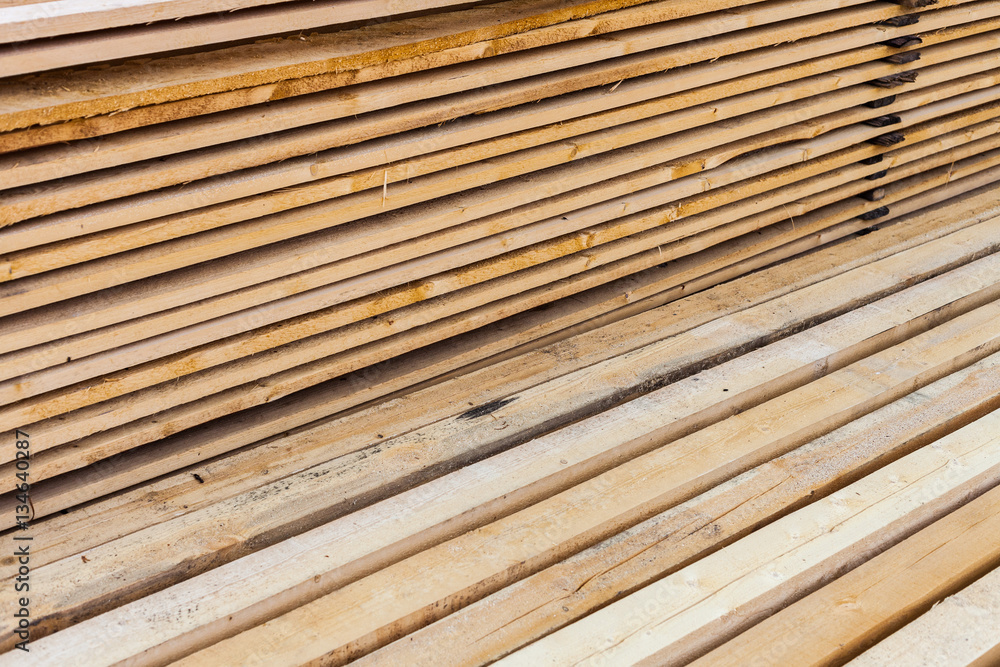 Stack of wooden terrace planks at the lumber yard. Stack of wooden terrace planks at the lumber yard.