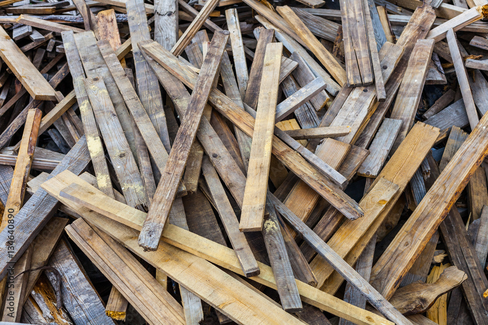 Pile of old used timber planks. Landfill of wooden slats bad Stock