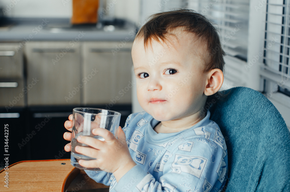 child drinks water from a glass child drinks water from a glass