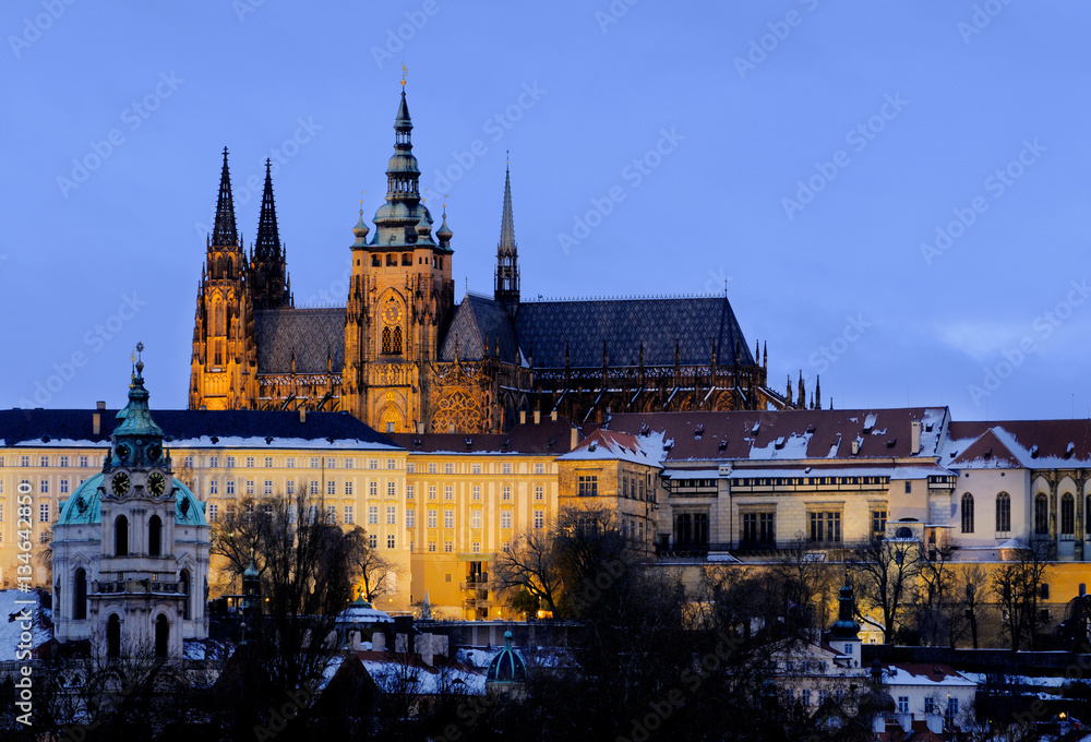Illuminated Prague Castle in winter evening