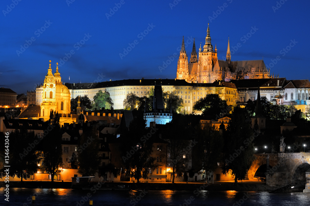 Evening view of Prague Castle and Charles Bridge from Novotneho