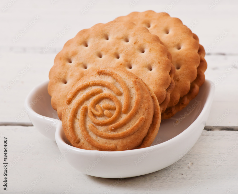 Tasty baked cookies on old wooden background. Tasty baked cookies on old wooden background.