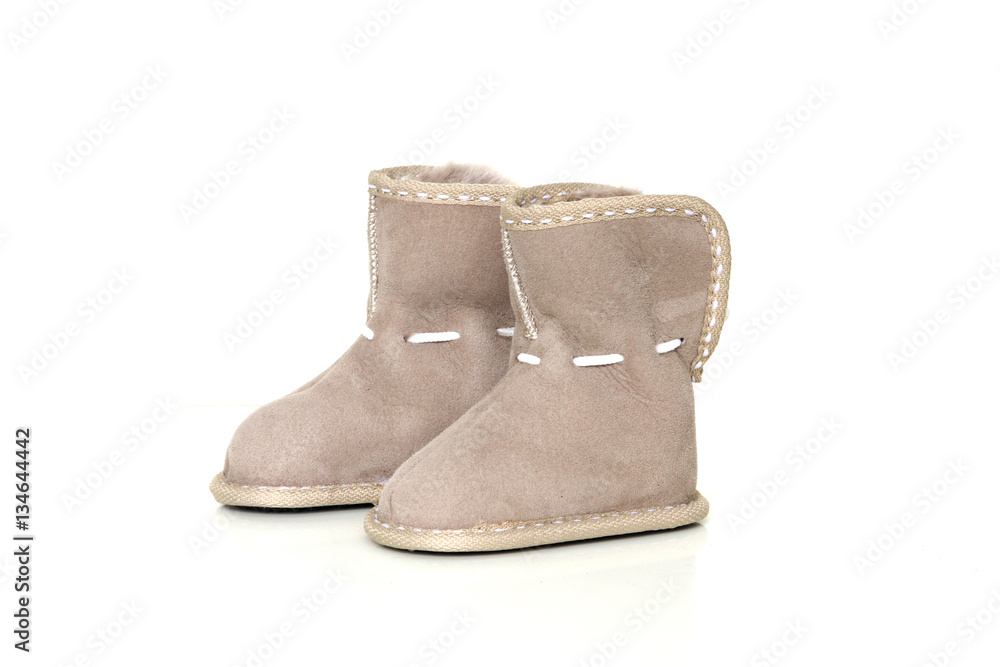 Babies sheepskin boots isolated on white background Babies sheepskin boots isolated on white background