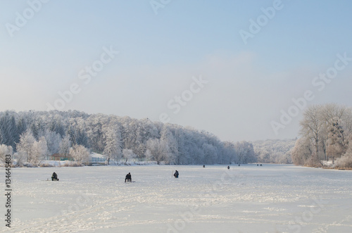 Winter fishing on frozen lake © andrei310