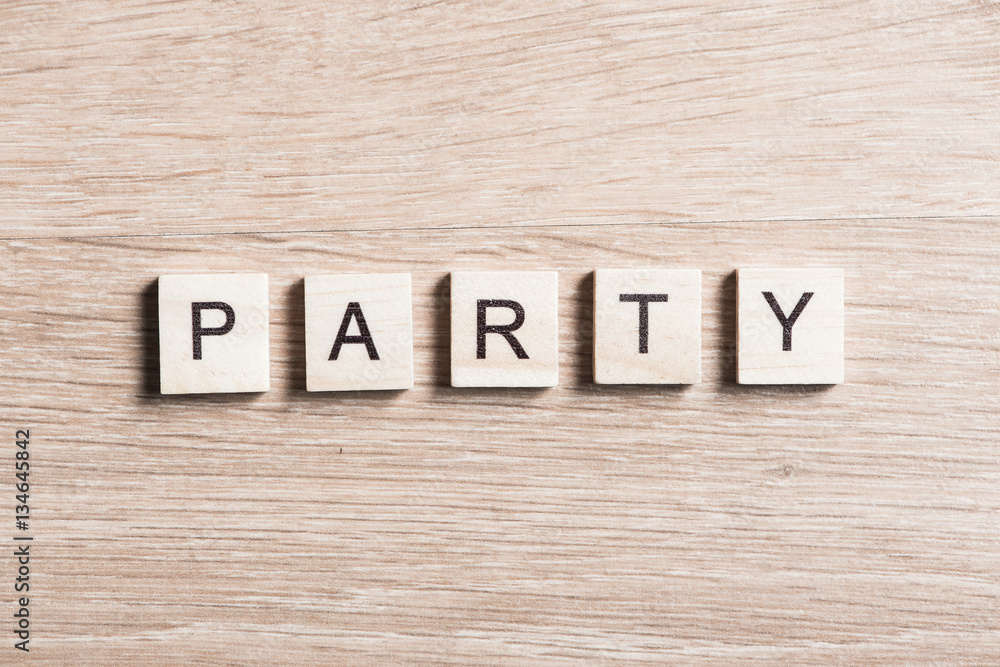 wooden elements with letter collected to word party