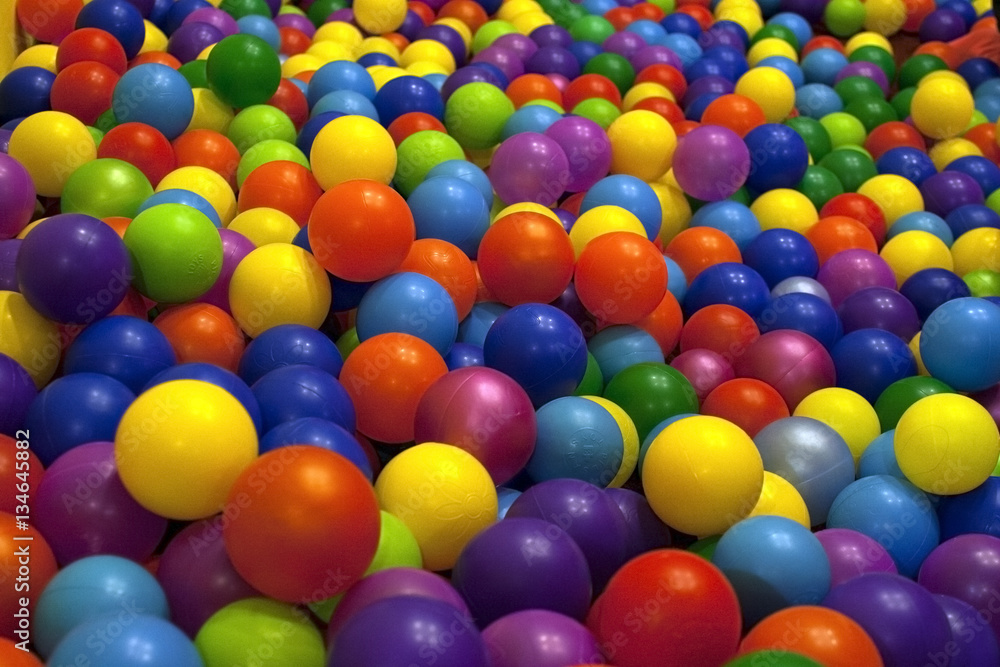Children's playroom. Bright colored balls of plastic for baby dr Children's playroom. Bright colored balls of plastic for baby dr