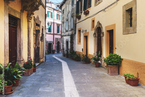 Spring streets of the old Tuscan town. Colorful flowers bloom an © Jarek Pawlak