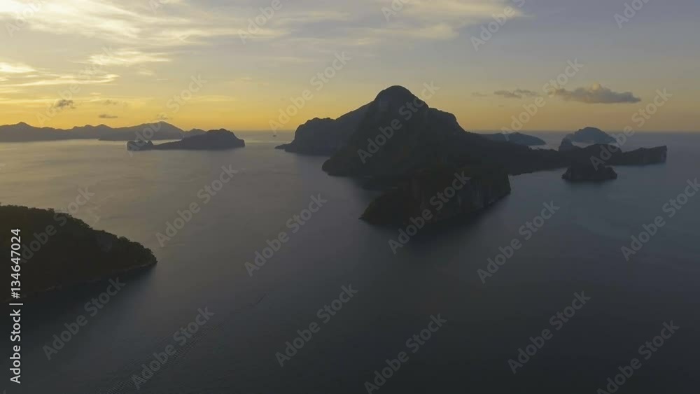 Tropical bay in El Nido sunset. Aerial view: tropical landscape. Sunset sky and mountains rocks of bay. Dreamy sunset among the rocks. Aerial video tropical island.Philippines,El Nido. 4K video Tropical bay in El Nido sunset. Aerial view: tropical landscape. Sunset sky and mountains rocks of bay. Dreamy sunset among the rocks. Aerial video tropical island.Philippines,El Nido. 4K video