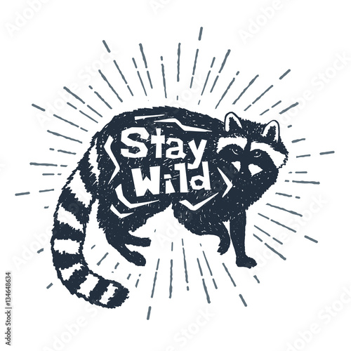Hand drawnl label with textured raccoon vector illustration and "Stay wild" inspirational lettering.