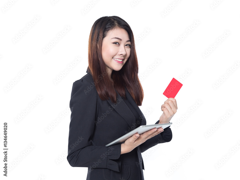 Business woman holding tablet and red card in hands isolated on white background, smart card concept Business woman holding tablet and red card in hands isolated on white background, smart card concept
