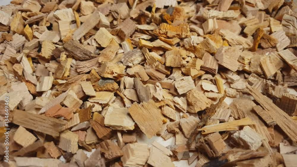 Wood chips for smoking or recycle rotate on the table. Macro shot. Wood chips for smoking or recycle rotate on the table. Macro shot.