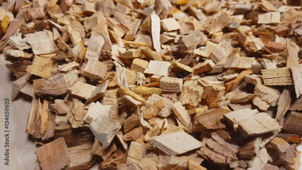 Wood chips for smoking or recycle rotate on the table. Macro shot. Wood chips for smoking or recycle rotate on the table. Macro shot.