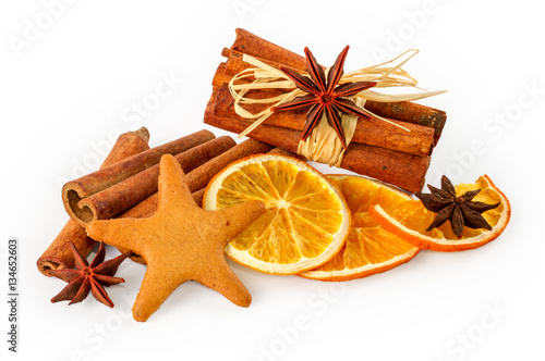 Dried oranges, star anise, cinnamon sticks and gingerbread, isolated on white background