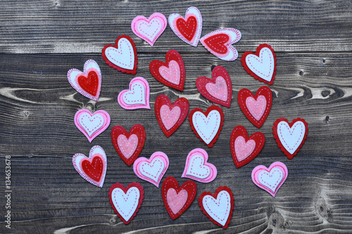 Fototapeta Naklejka Na Ścianę i Meble -  colorful felt heart on wood as valentines day decoration
