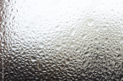 Windowpane with frozen water drops as a background