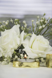 wedding table decoration with fake roses and gold colour candles