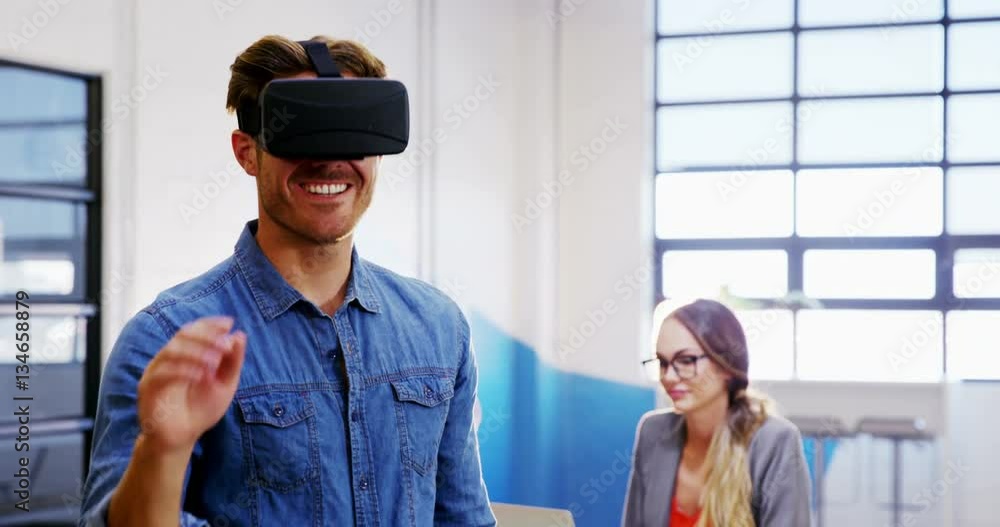 Businessman using the virtual reality headset in office 4k Businessman using the virtual reality headset in office 4k