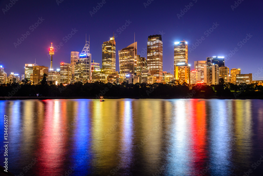 mirrored Sydney Skyline in the water after sunset , Australia