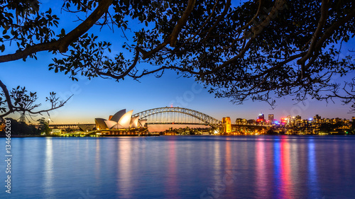 Photography mirrored Sydney Skyline in the water after sunset , Australia