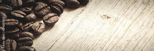 Close-up of coffee beans on wooden background