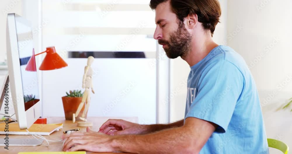 Male volunteer working on computer in office 4k Male volunteer working on computer in office 4k