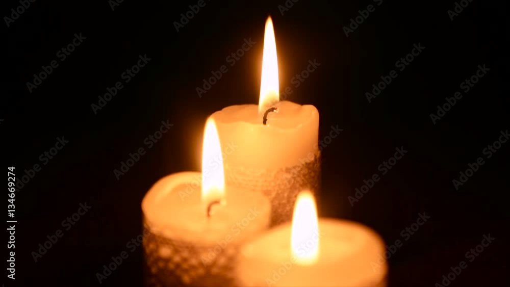 Three burning candles in the dark Three burning candles in the dark