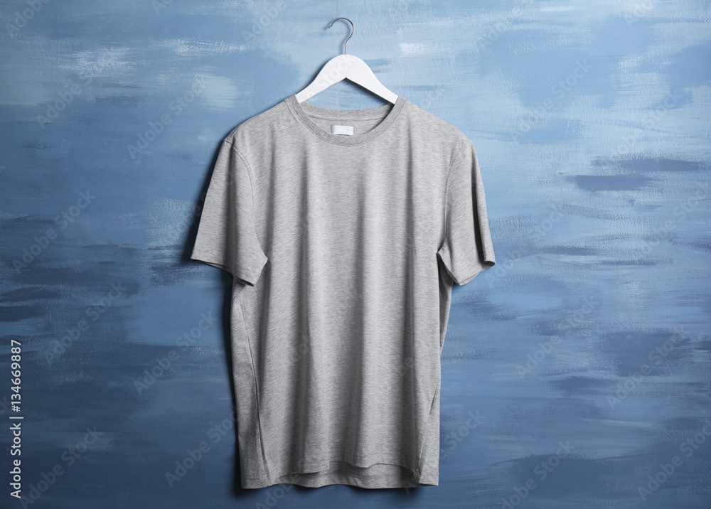Blank grey t-shirt against grunge background Blank grey t-shirt against grunge background