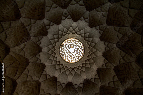 Light well in Yazd bazar, Iran, taken from below, thus creating an impressive geometric background photo