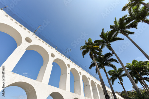 Carioca Aqueduct, Also Known as Arch of Lapa, in the Blue Sky, with Palm Trees, Rio de Janeiro, Brazil