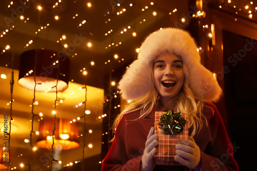Woman with gift box on Chri...