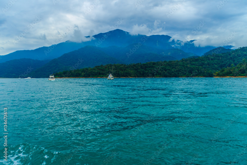 Tourist likes to visit the beautiful attractions around the sun moon lake by boat cruise from Shuishe Pier to Ita Thao Pier, and then to Xuanguang Temple Pier