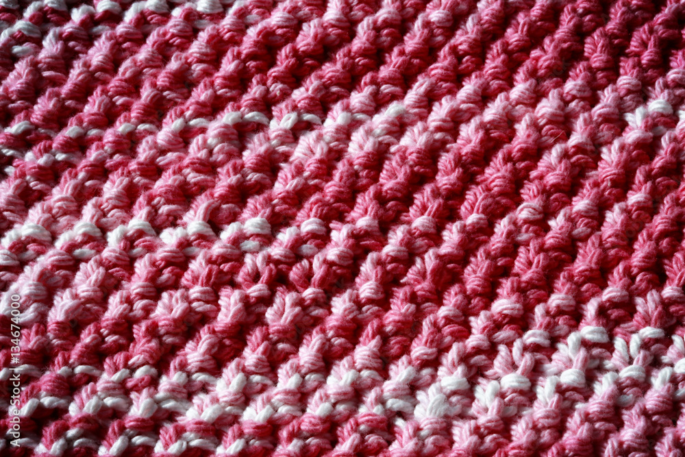Handmade knitted fabric background - blanket for baby girl