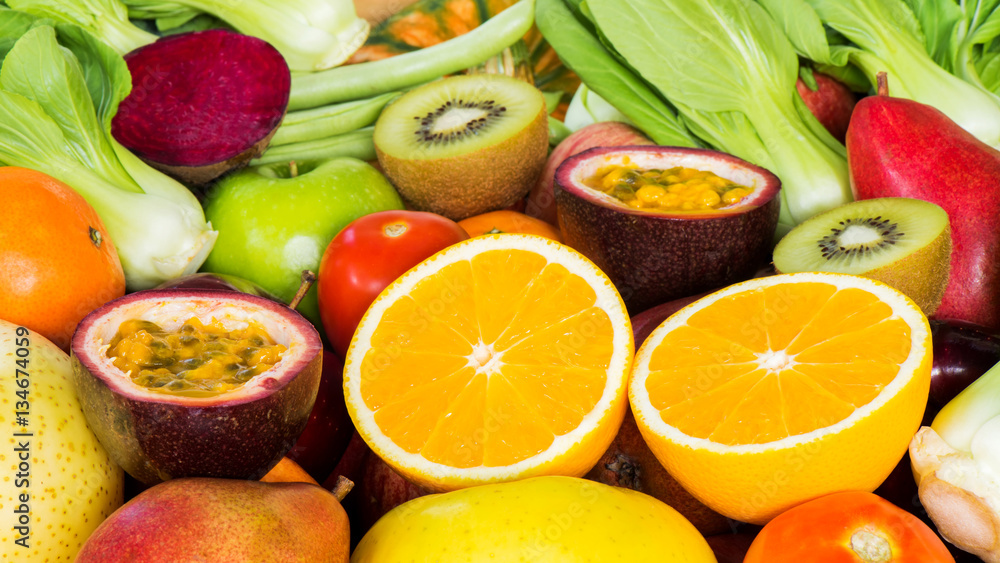 Closeup Orange slice with Various fresh fruits and vegetables for eating healthy Closeup Orange slice with Various fresh fruits and vegetables for eating healthy