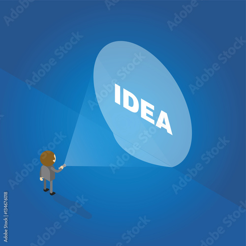 Businessman with a flashlight looking at word idea on the wall