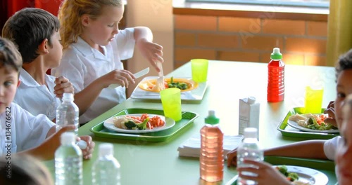 Kids having meal in school cafeteria 4k