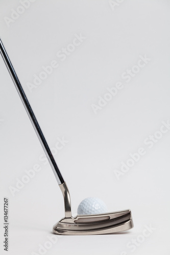 golf ball and putter on White background photo