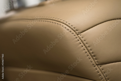 Car interior detail background. Part of leather seat. Macro photo.