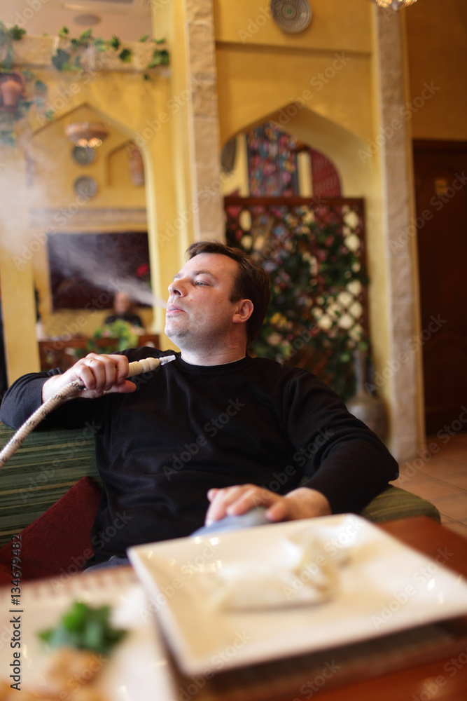 Man smoking shisha Man smoking shisha