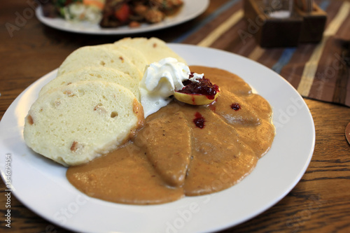 Photography Goulash served with bread dumplings and lemon