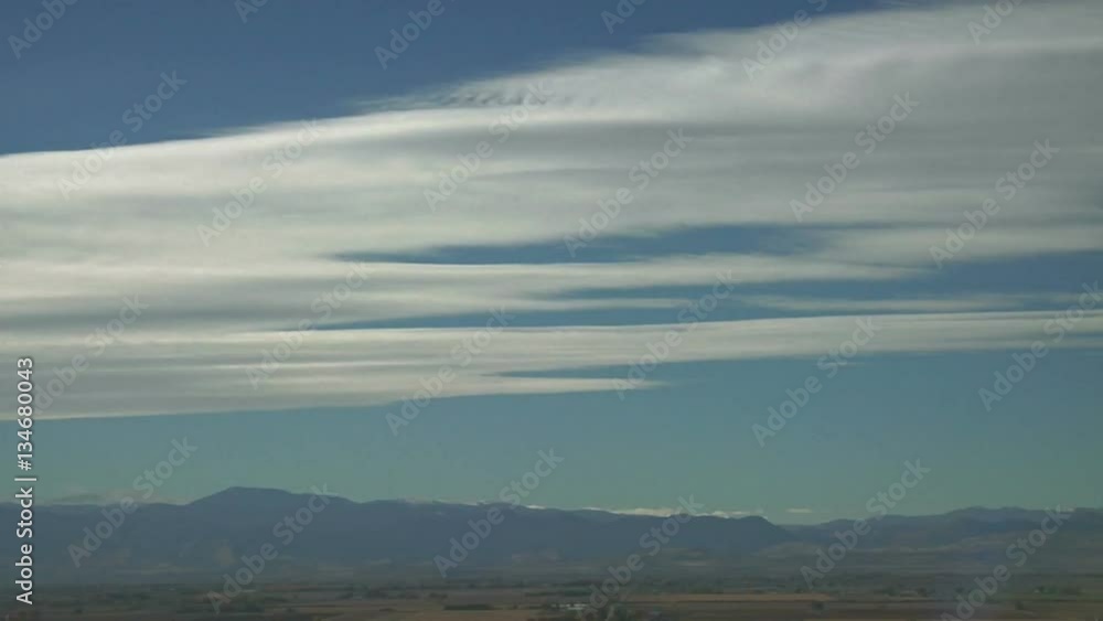 Clouds Ride Jet Stream Winds over Rocky Mountains Clouds Ride Jet Stream Winds over Rocky Mountains