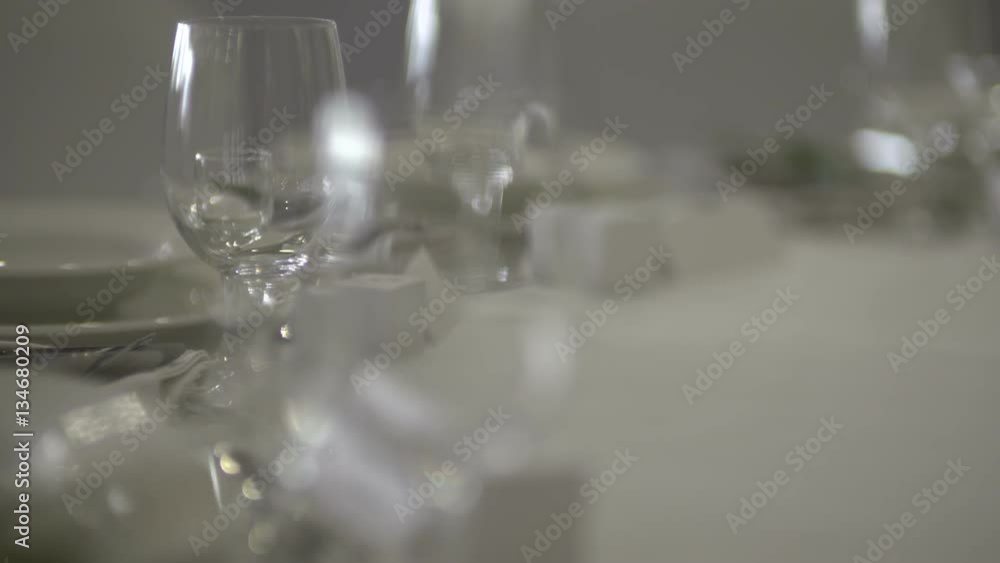 Table with wine glasses of wedding arrangement at he sunset. Table with wine glasses of wedding arrangement at he sunset.
