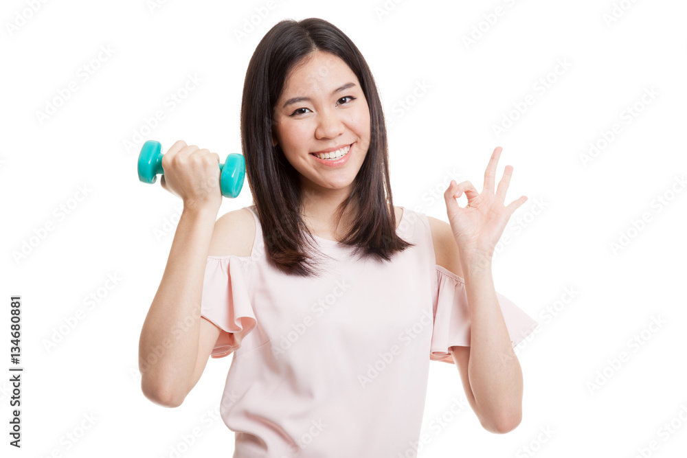 Healthy Asian business woman show OK with dumbbells. Healthy Asian business woman show OK with dumbbells.