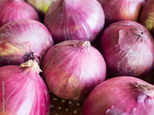 Onions in basket. Food ingredient.